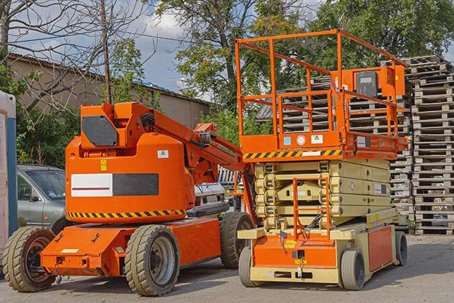 forklift transporting boxes in a busy warehouse in Blue Ash, OH